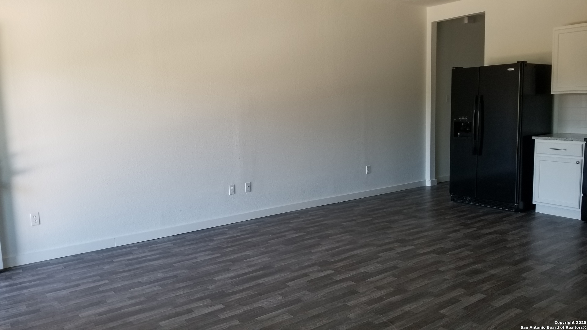 1063 Sleepy Spring Branch, TX 78070 - Photo 5 of 14 a view of an empty room with wooden floor