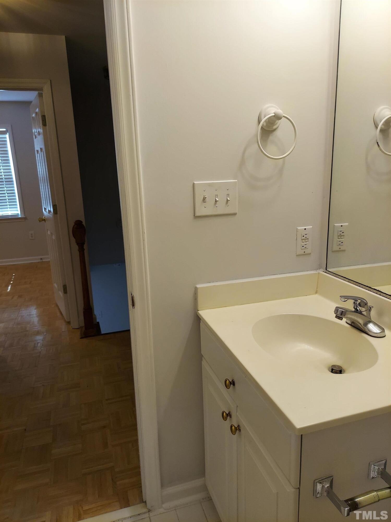 224 Crossfire Road Holly Springs, NC 27540 - Photo 28 of 43 a bathroom with a sink and a mirror