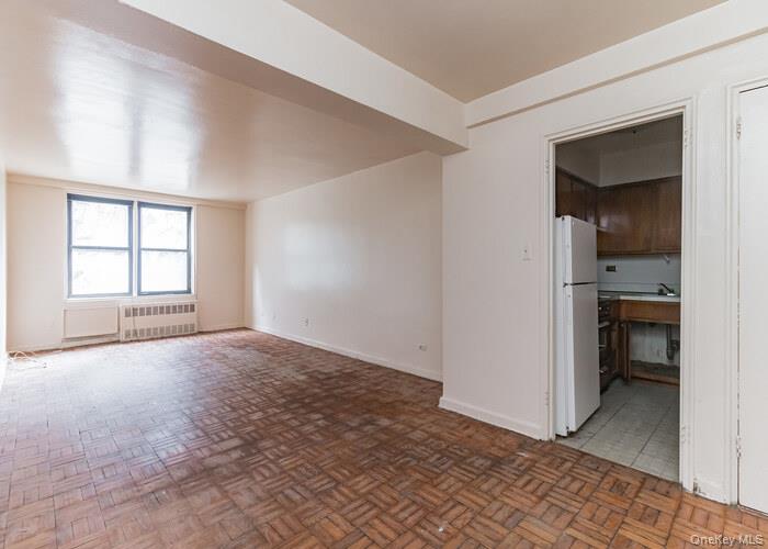 5235 Post Road, Unit 1B Bronx, NY 10471 - Photo 11 of 20 an empty room with windows and entrance