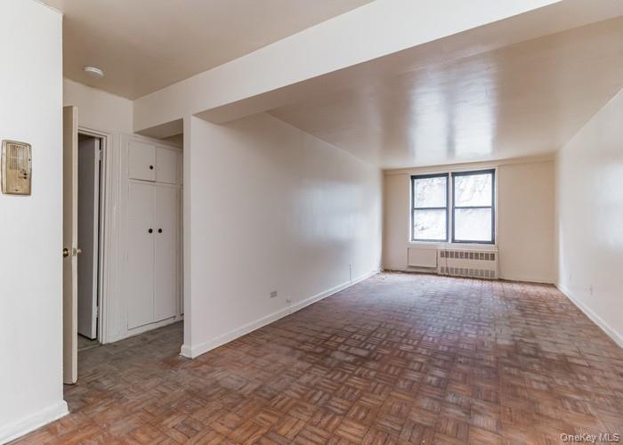 5235 Post Road, Unit 1B Bronx, NY 10471 - Photo 14 of 20 an empty room with windows and closet