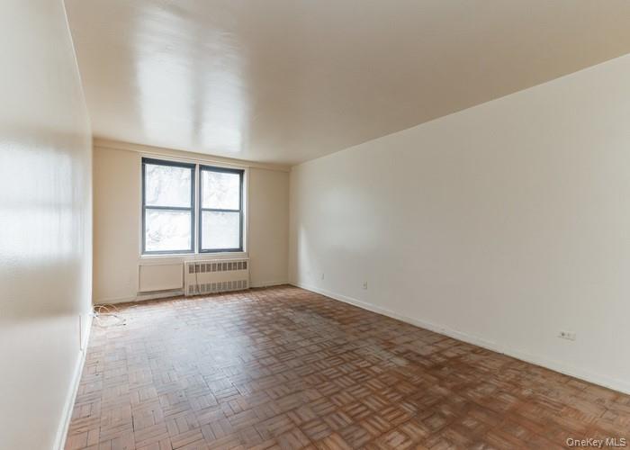 5235 Post Road, Unit 1B Bronx, NY 10471 - Photo 15 of 20 an empty room with windows