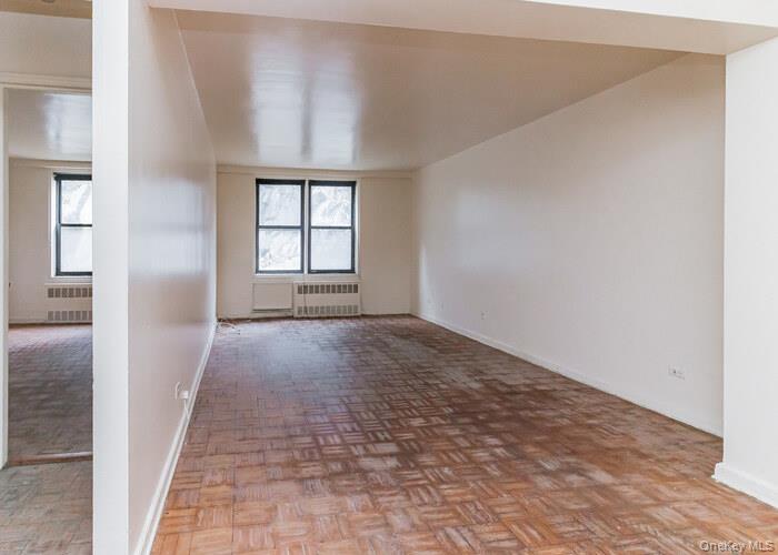 5235 Post Road, Unit 1B Bronx, NY 10471 - Photo 16 of 20 an empty room with windows