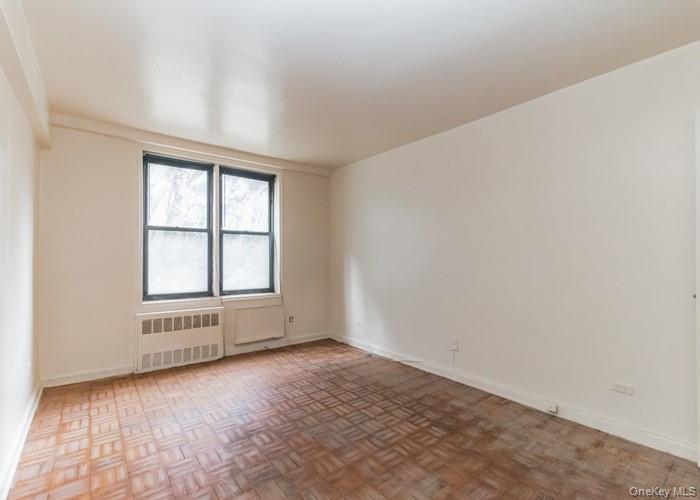 5235 Post Road, Unit 1B Bronx, NY 10471 - Photo 8 of 20 an empty room with windows