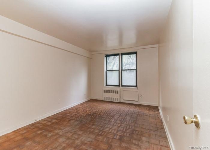 5235 Post Road, Unit 1B Bronx, NY 10471 - Photo 9 of 20 an empty room with windows