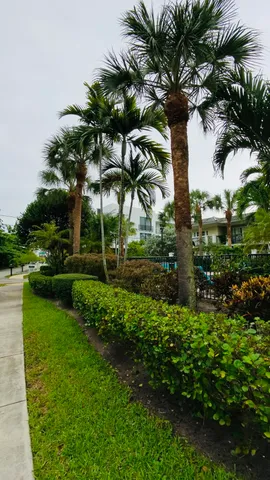a bathroom with a granite countertop toilet and a sink