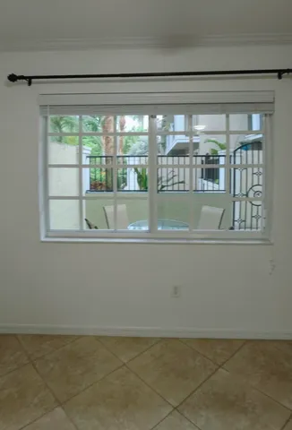 a bathroom with a granite countertop toilet and a sink