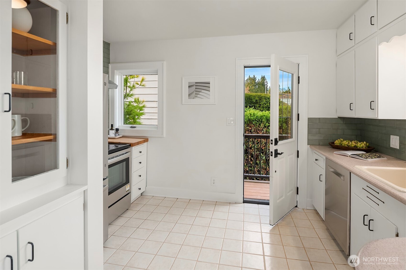 2503 37th Avenue West Seattle, WA 98199 - Photo 13 of 36 a kitchen with a stove and a refrigerator