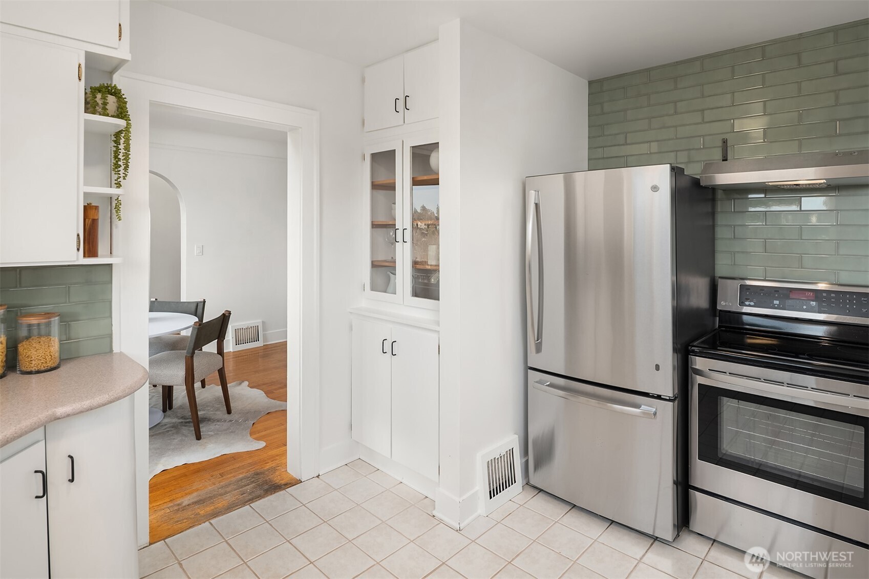 2503 37th Avenue West Seattle, WA 98199 - Photo 15 of 36 a kitchen with stainless steel appliances granite countertop a refrigerator and a stove