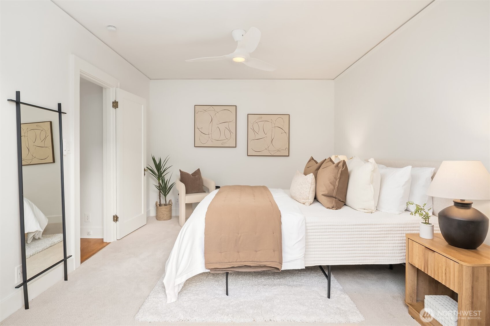 2503 37th Avenue West Seattle, WA 98199 - Photo 16 of 36 a bedroom with a bed and wooden floor