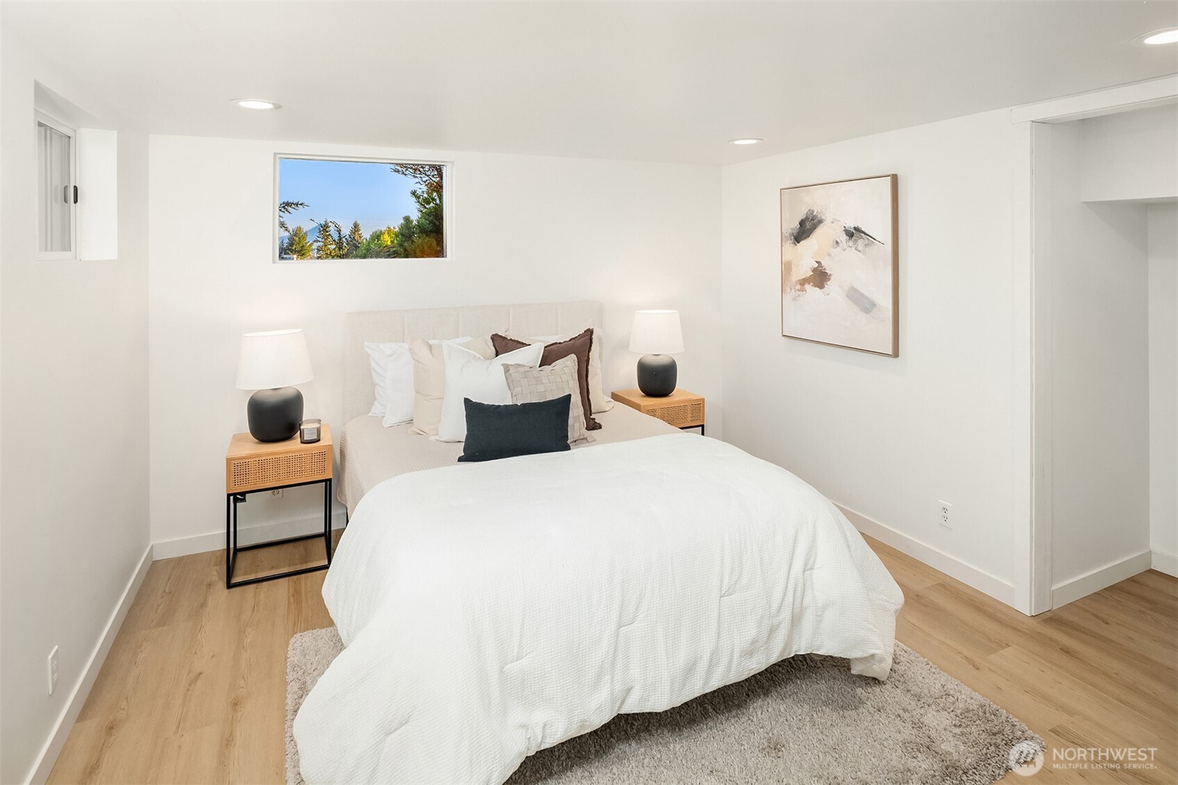 2503 37th Avenue West Seattle, WA 98199 - Photo 27 of 36 a bedroom with bed and cupboard