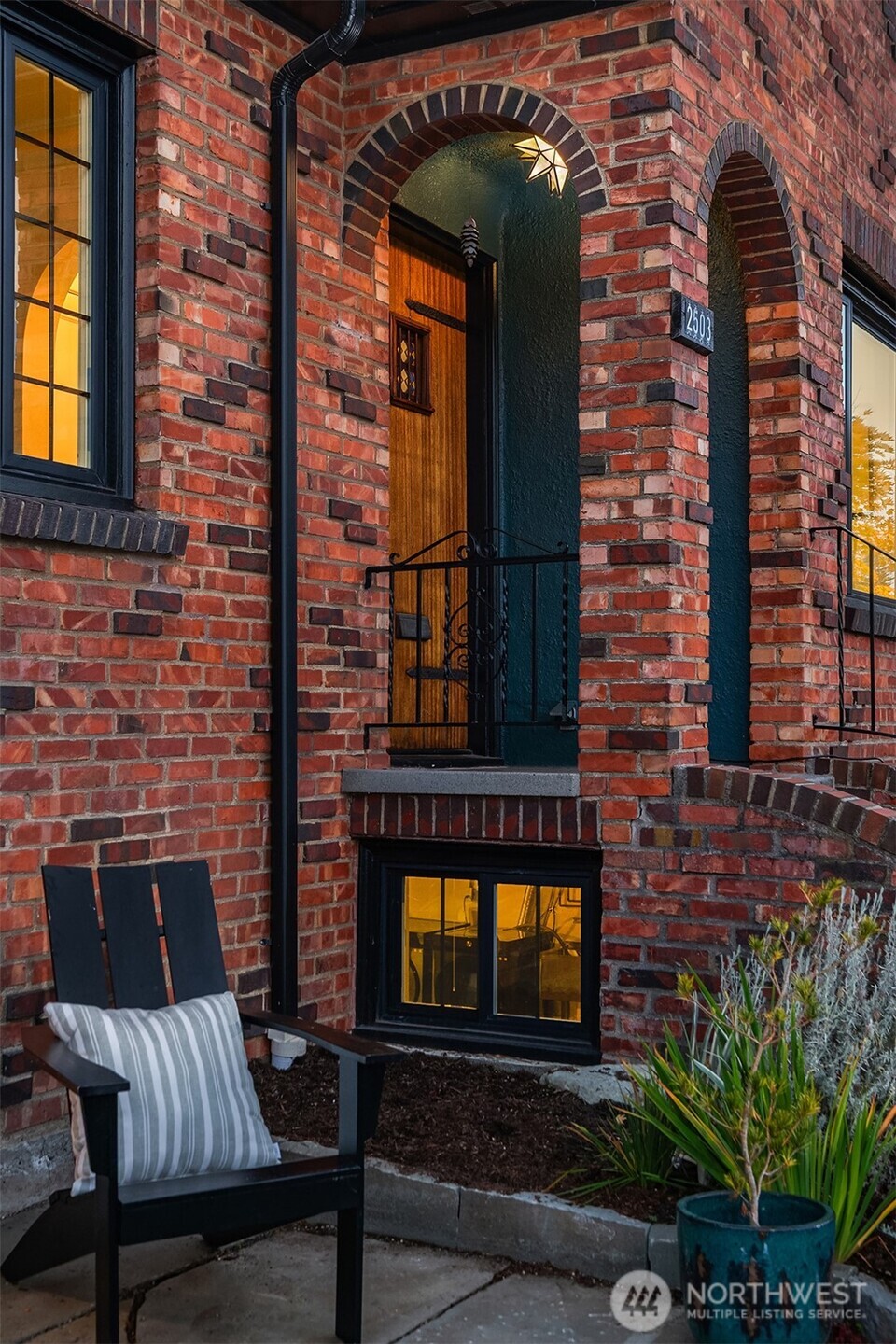 2503 37th Avenue West Seattle, WA 98199 - Photo 3 of 36 a brick building with a door and a window