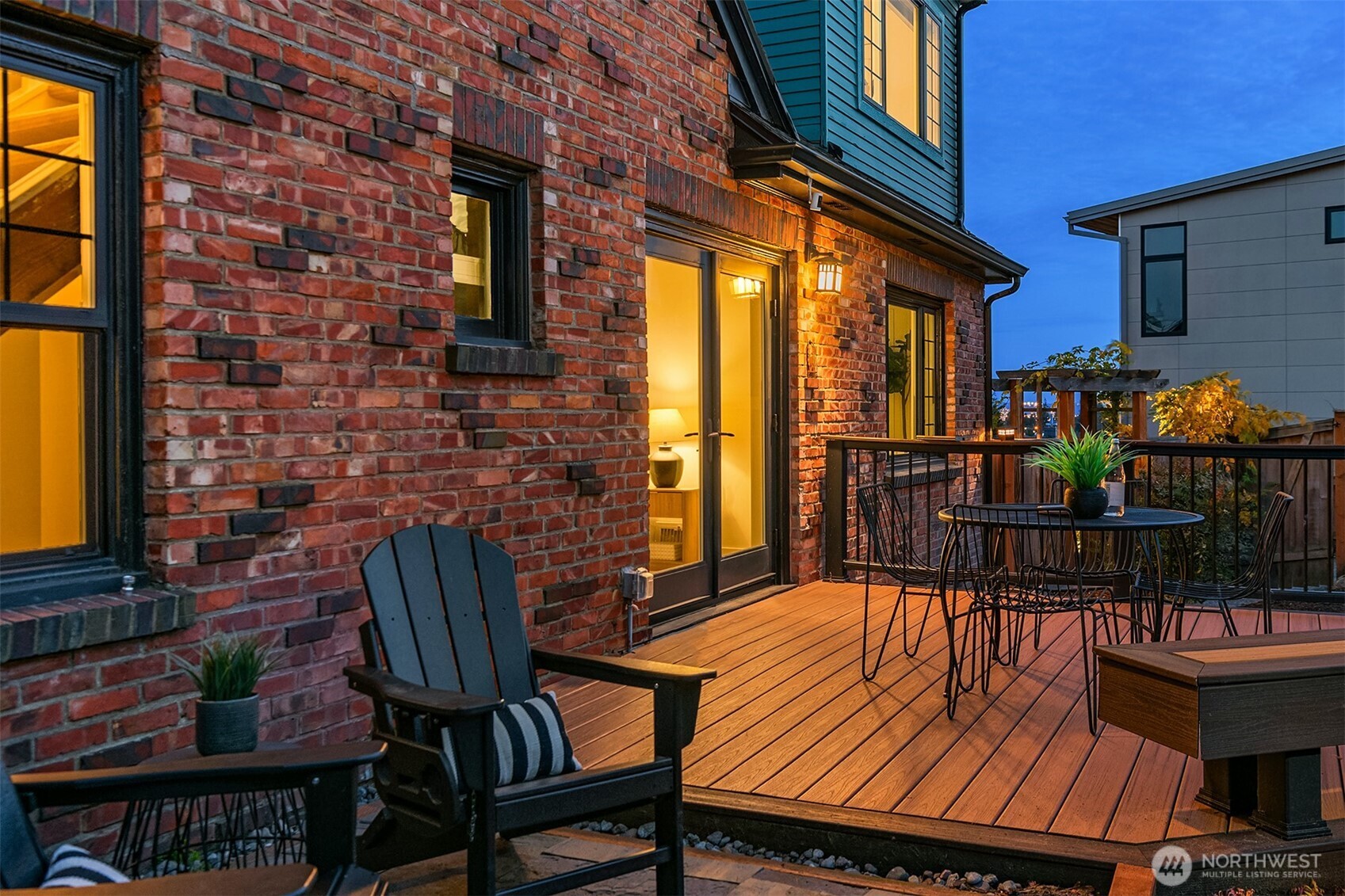 2503 37th Avenue West Seattle, WA 98199 - Photo 31 of 36 a view of a patio with couches table and chairs and potted plants