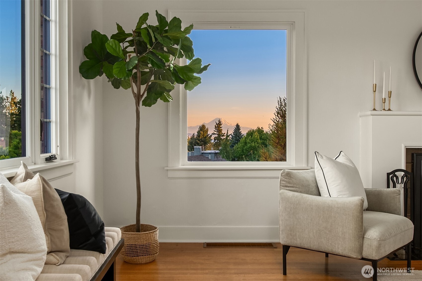 2503 37th Avenue West Seattle, WA 98199 - Photo 4 of 36 a vase of flowers sitting on a table with a mirror