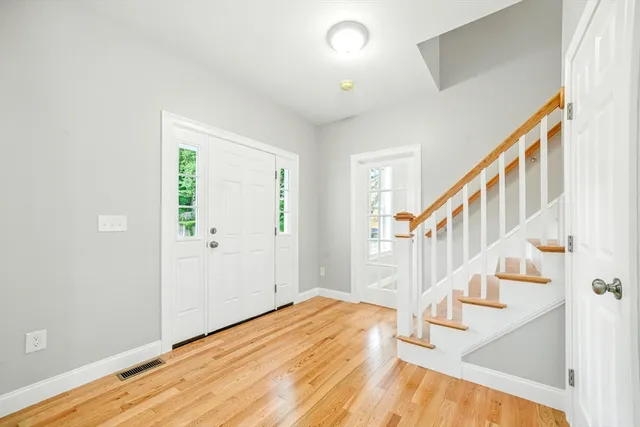 a view of entryway with wooden floor