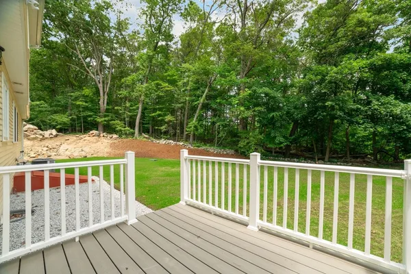 a view of balcony with wooden floor