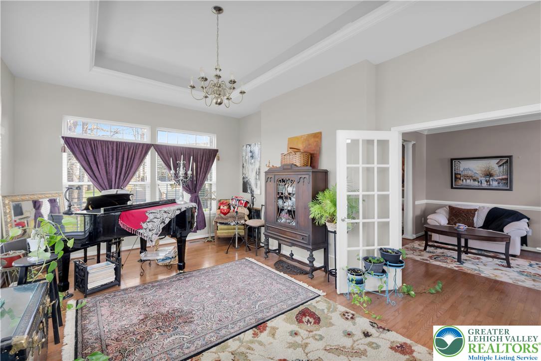 222 Lower Way Road Easton, PA 18045 - Photo 12 of 45 a living room with furniture a rug and a chandelier