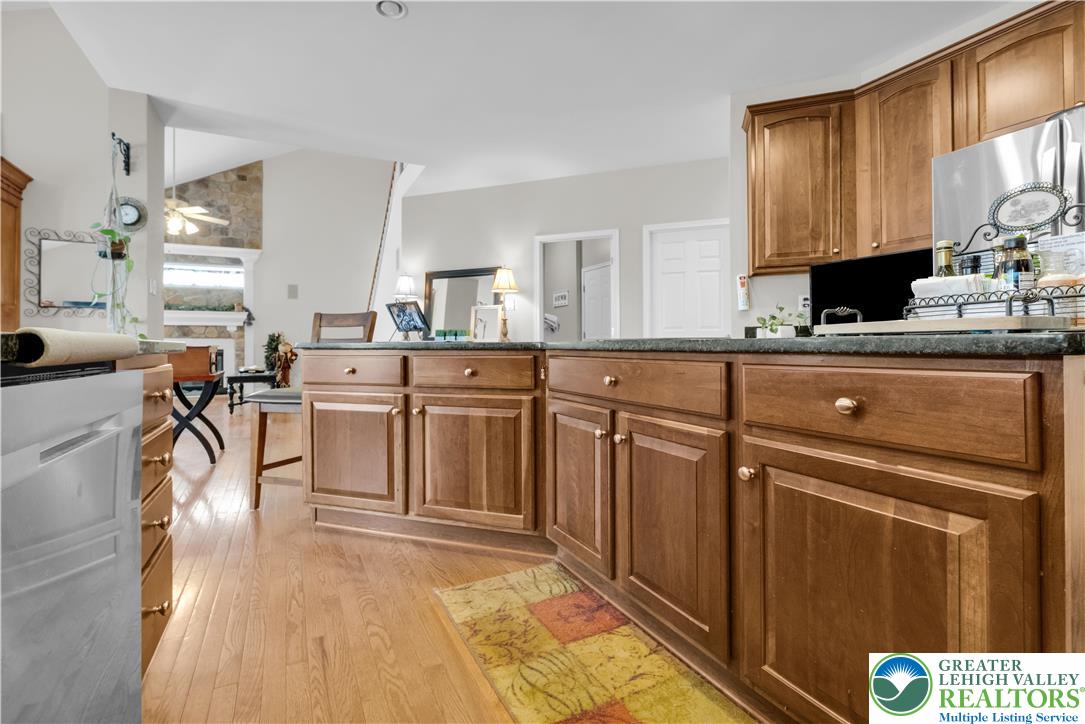 222 Lower Way Road Easton, PA 18045 - Photo 17 of 45 a kitchen with stainless steel appliances granite countertop a stove a sink dishwasher and cabinets with wooden floor