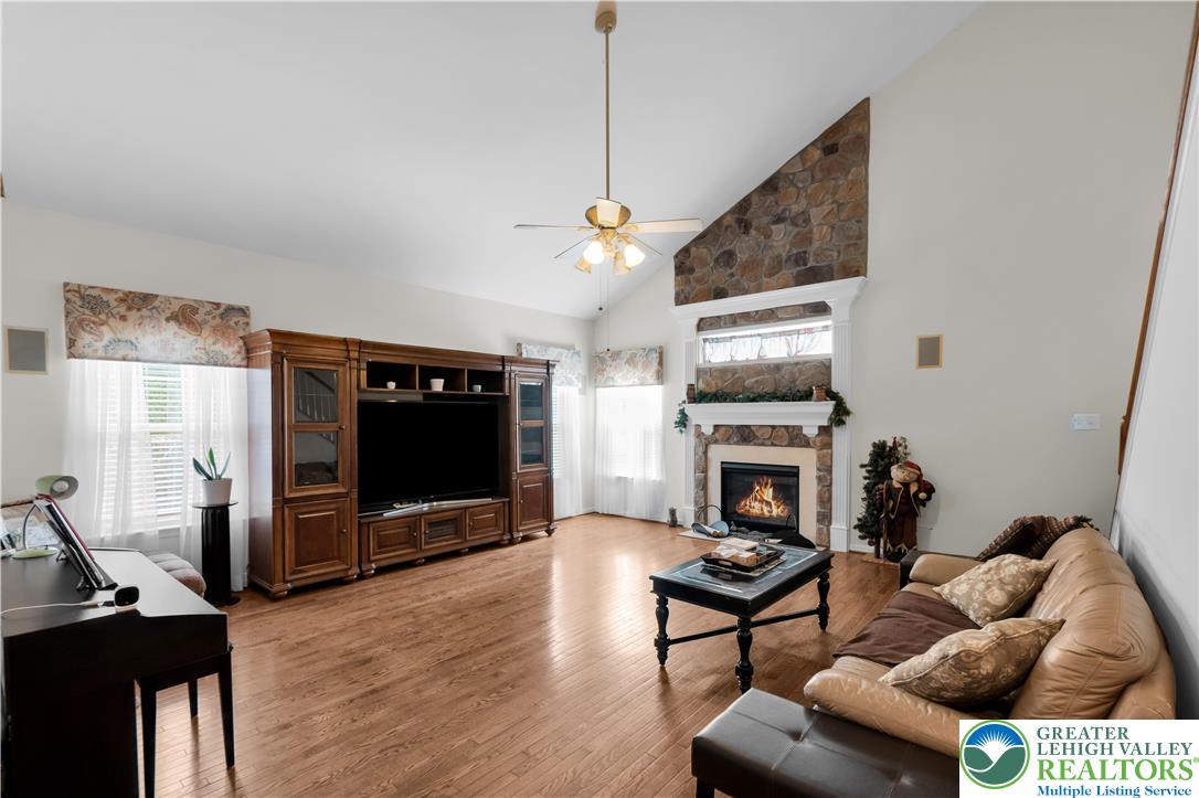 222 Lower Way Road Easton, PA 18045 - Photo 18 of 45 a living room with furniture a flat screen tv and wooden floor