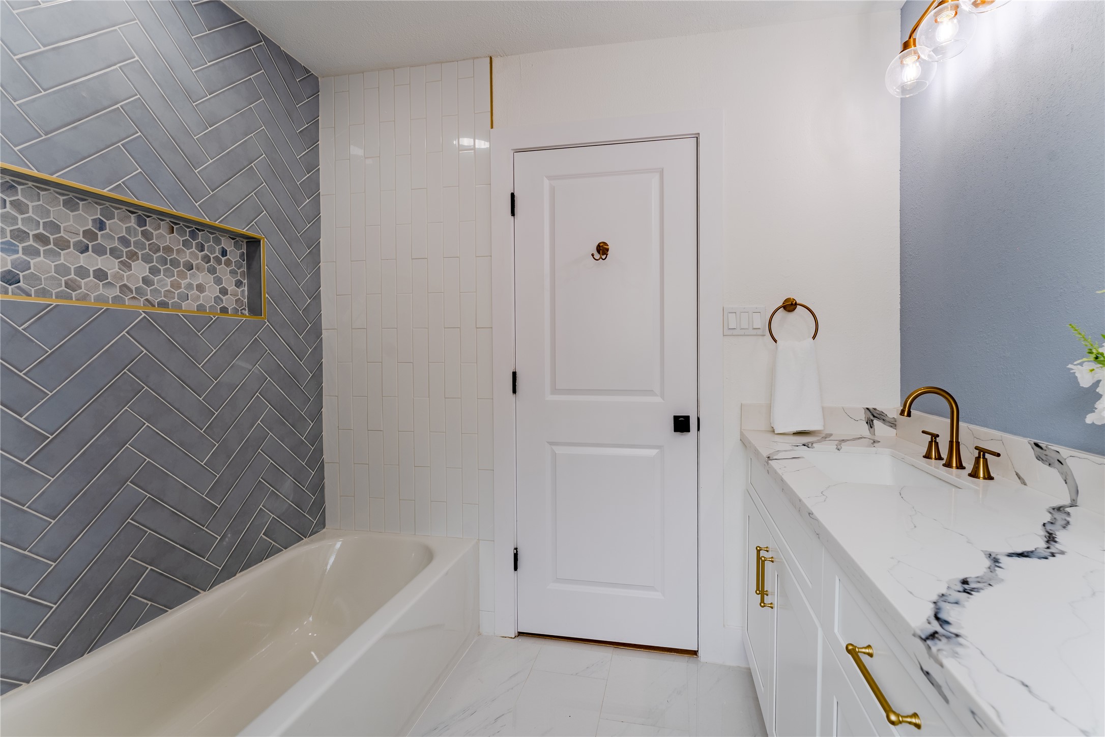 6027 Valkeith Drive Houston, TX 77096 - Photo 6 of 31 a bathroom with a tub sink vanity and mirror