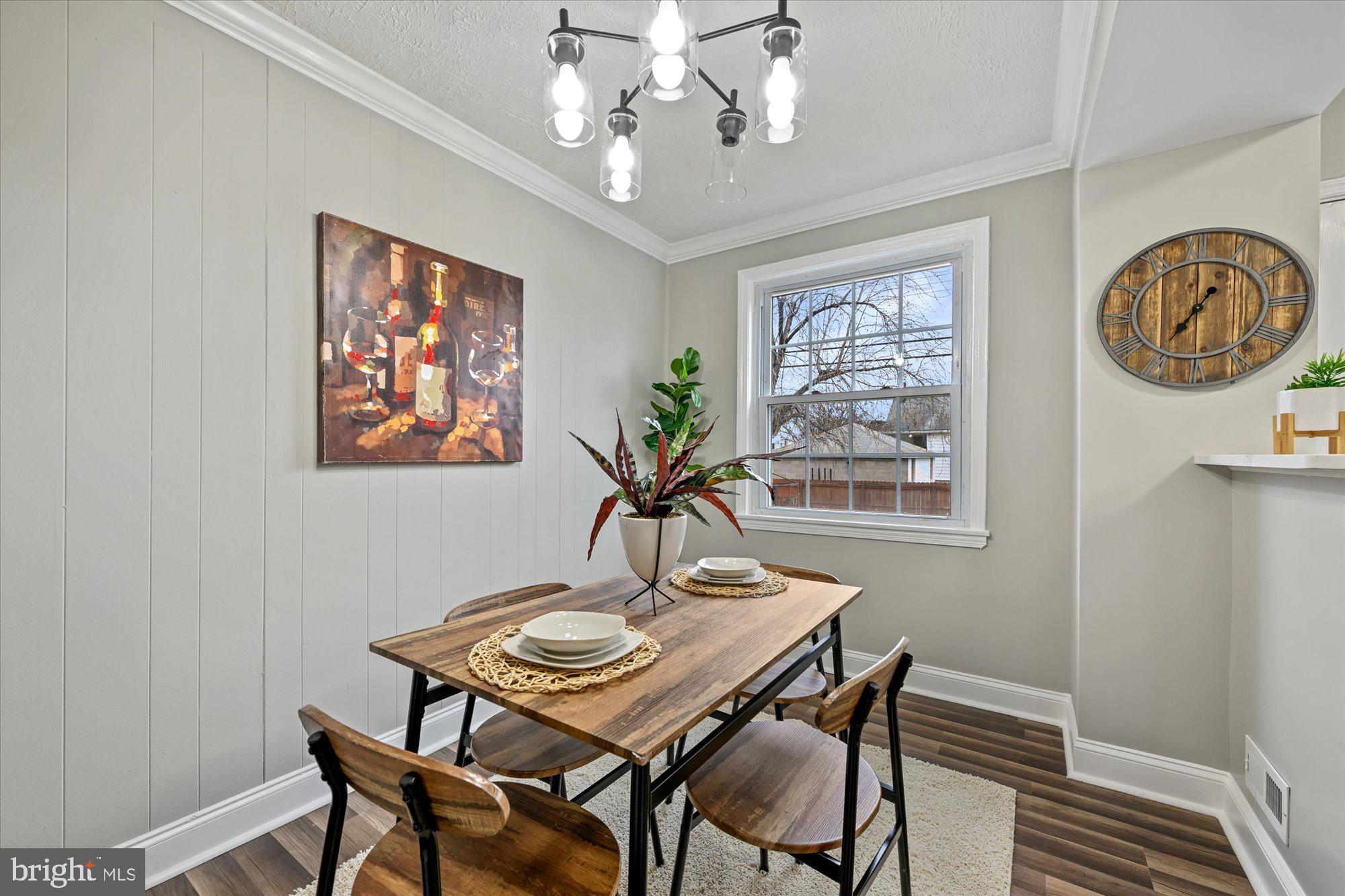 8160 Kavanagh Road Baltimore, MD 21222 - Photo 7 of 25 New laminate flooring, trim, paint, light fixture