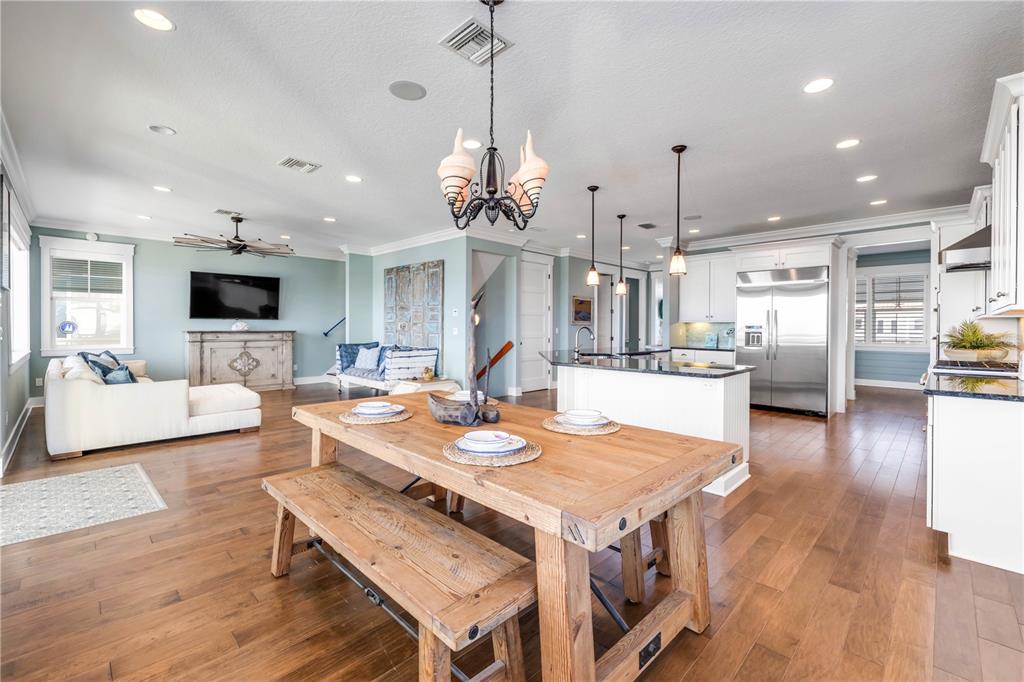 6101 Turtlemound Road New Smyrna Beach, FL 32169 - Photo 18 of 82 a large kitchen with a table and chairs