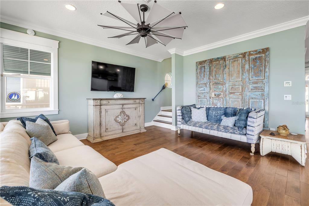 6101 Turtlemound Road New Smyrna Beach, FL 32169 - Photo 21 of 82 a living room with furniture and a flat screen tv