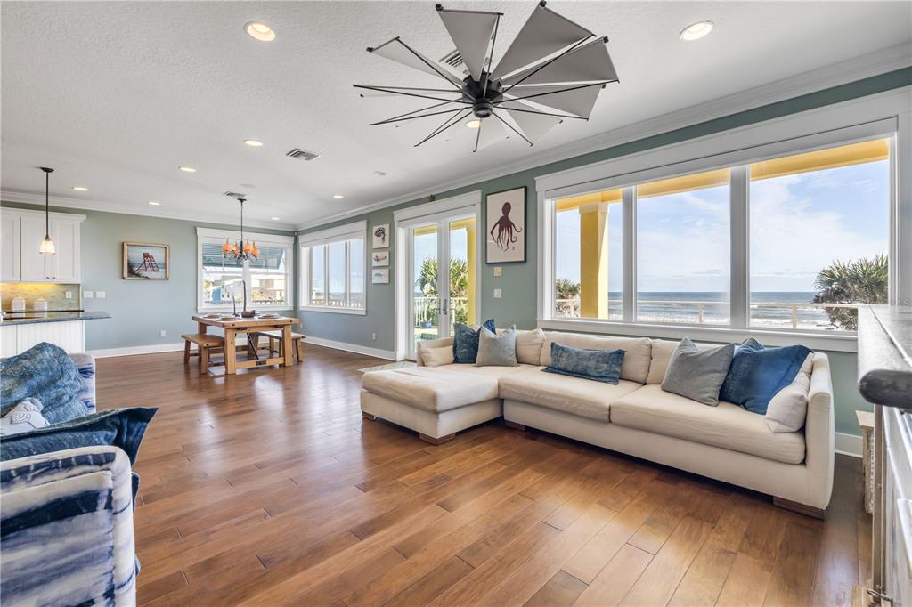 6101 Turtlemound Road New Smyrna Beach, FL 32169 - Photo 22 of 82 a living room with furniture and a large window