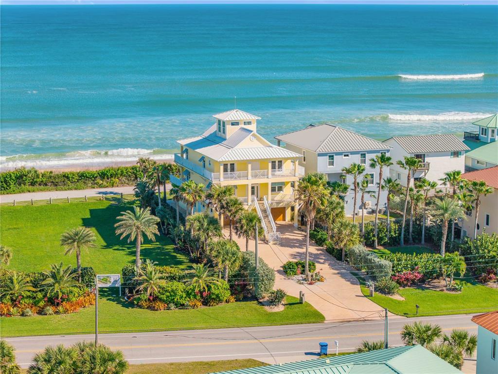 6101 Turtlemound Road New Smyrna Beach, FL 32169 - Photo 3 of 82 a front view of a house with a yard