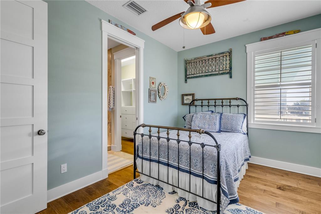 6101 Turtlemound Road New Smyrna Beach, FL 32169 - Photo 33 of 82 a bedroom with a bed and window