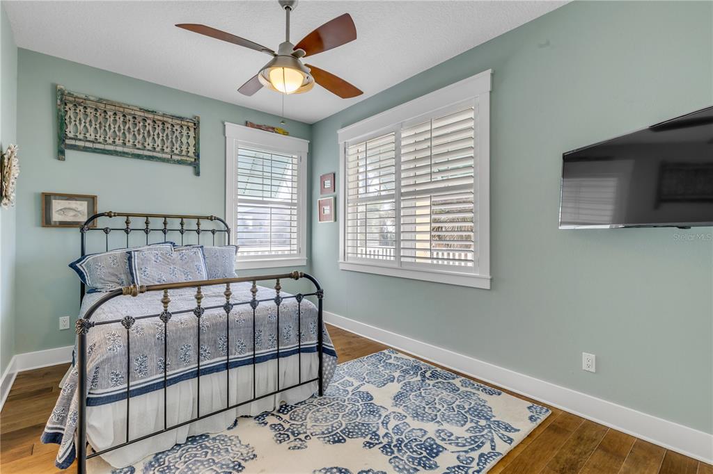 6101 Turtlemound Road New Smyrna Beach, FL 32169 - Photo 34 of 82 a bedroom with a bed and a window