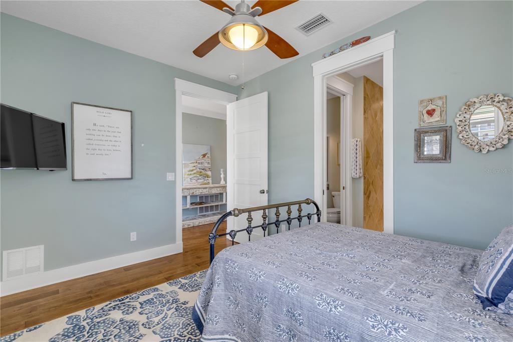 6101 Turtlemound Road New Smyrna Beach, FL 32169 - Photo 35 of 82 a bedroom with a bed and a window