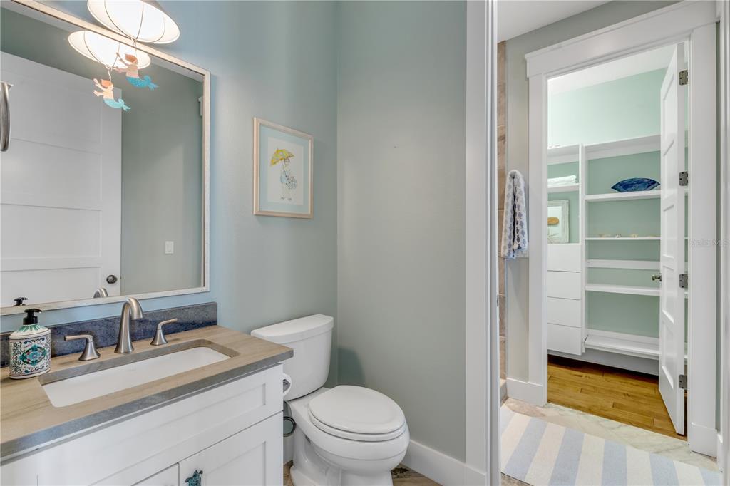 6101 Turtlemound Road New Smyrna Beach, FL 32169 - Photo 36 of 82 a bathroom with a granite countertop sink toilet and shower