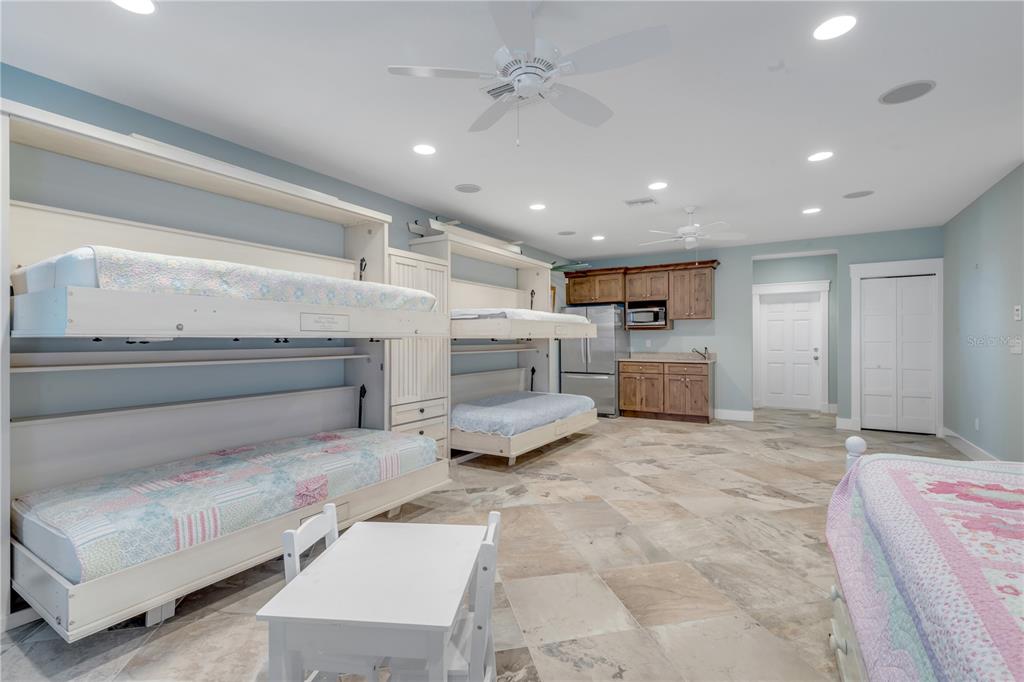 6101 Turtlemound Road New Smyrna Beach, FL 32169 - Photo 58 of 82 a living room with furniture and a fireplace