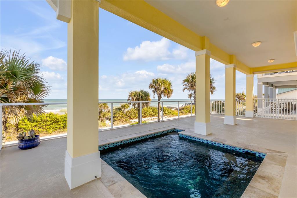 6101 Turtlemound Road New Smyrna Beach, FL 32169 - Photo 64 of 82 a view of a floor to ceiling window and an ocean view