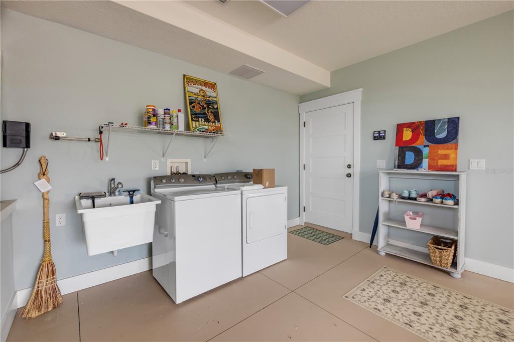 6101 Turtlemound Road New Smyrna Beach, FL 32169 - Photo 81 of 82 a room with storage and utility