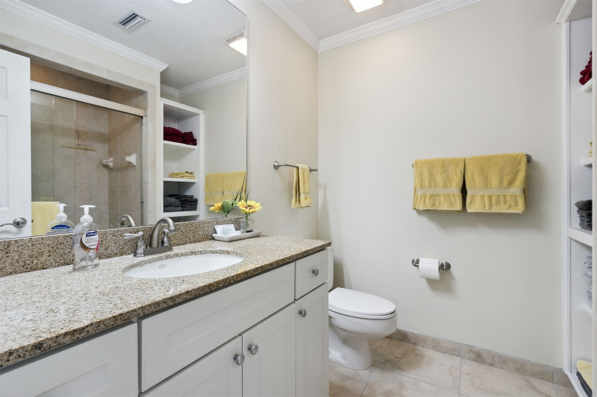 3327 Sea Marsh Road, Unit 3327 Fernandina Beach, FL 32034 - Photo 18 of 39 a bathroom with a granite countertop toilet sink and mirror