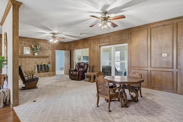 a view of a livingroom with furniture and a ceiling fan