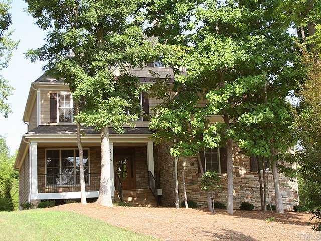 7315 Ridgeline Drive Raleigh, NC 27613 - Photo 1 of 8 a front view of a house with a tree