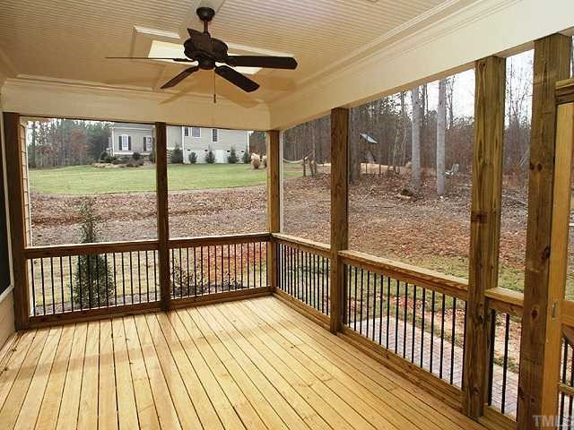 7315 Ridgeline Drive Raleigh, NC 27613 - Photo 8 of 8 a view of a balcony with a floor to ceiling window wooden floor