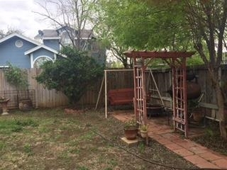 227 Northpoint Drive Laredo, TX 78041 - Photo 8 of 9 a view of a room with wooden fence and a large tree