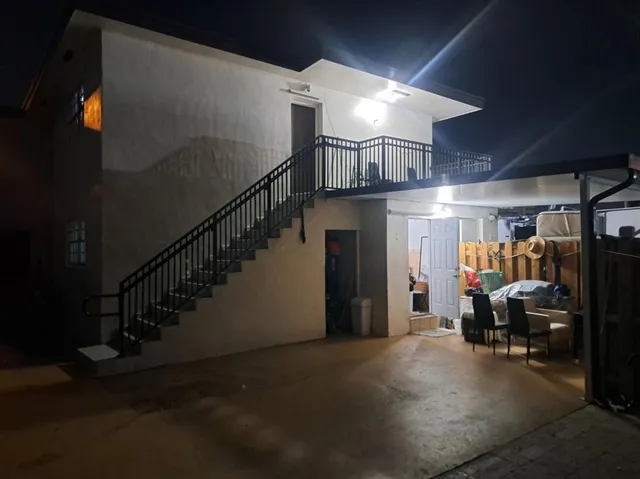 a view of a hallway with seating area