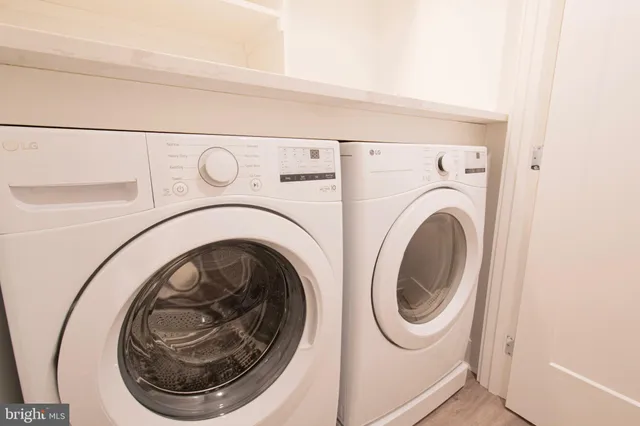 a utility room with dryer and washer
