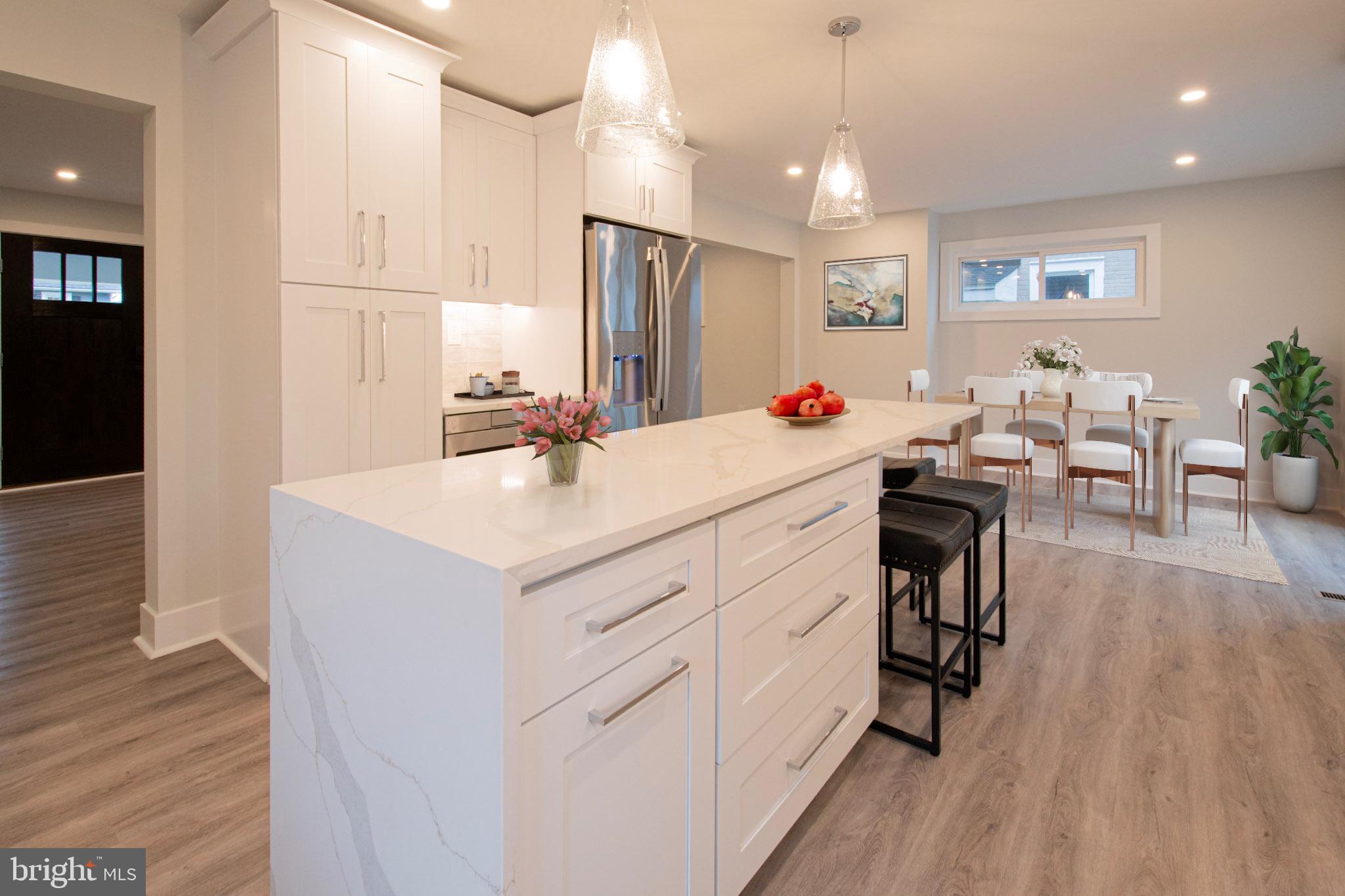 21 Manor Road Paoli, PA 19301 - Photo 2 of 35 a room with furniture a wooden floor and sink