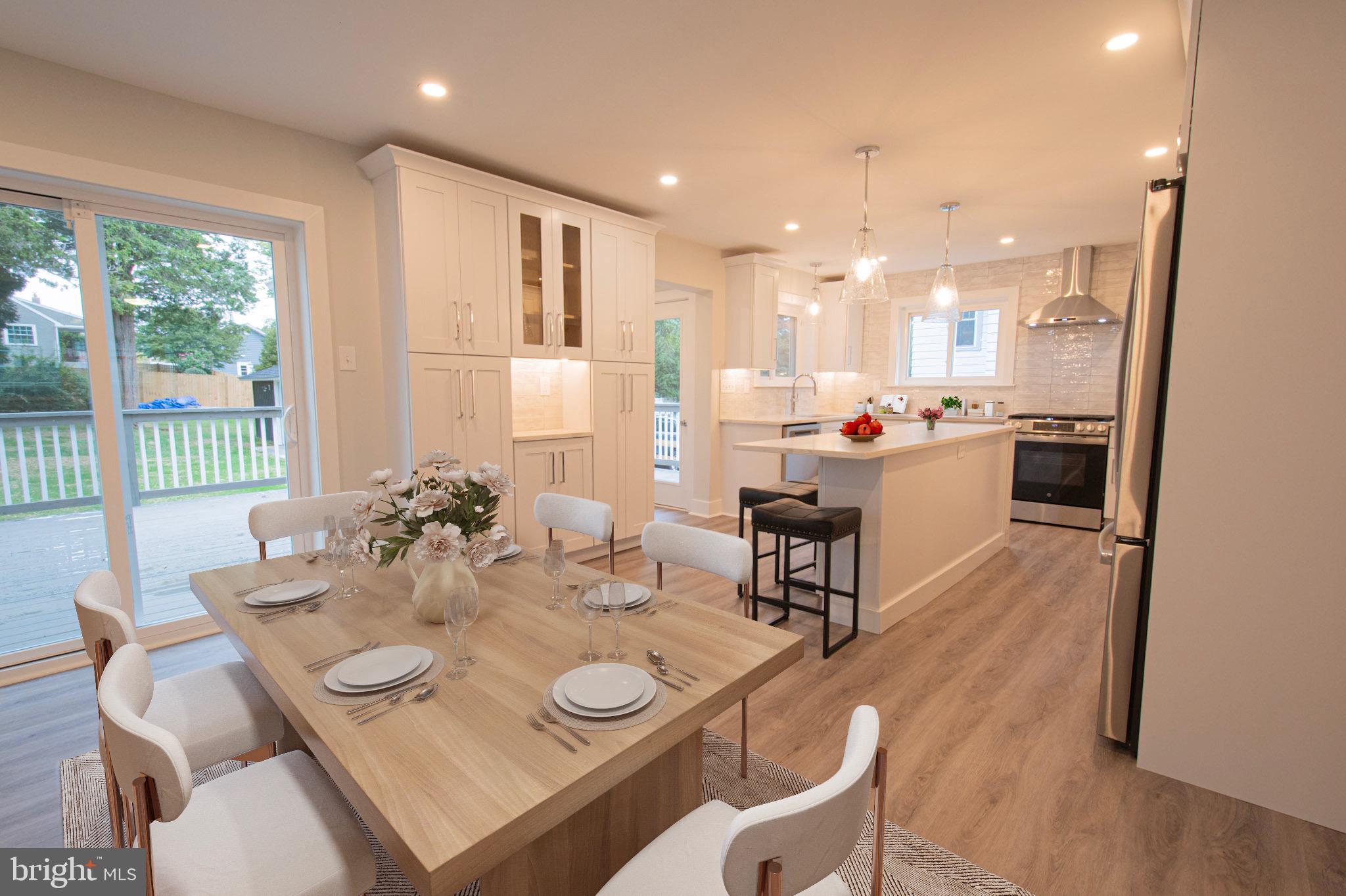 21 Manor Road Paoli, PA 19301 - Photo 4 of 35 a view of a dining room with furniture window and wooden floor