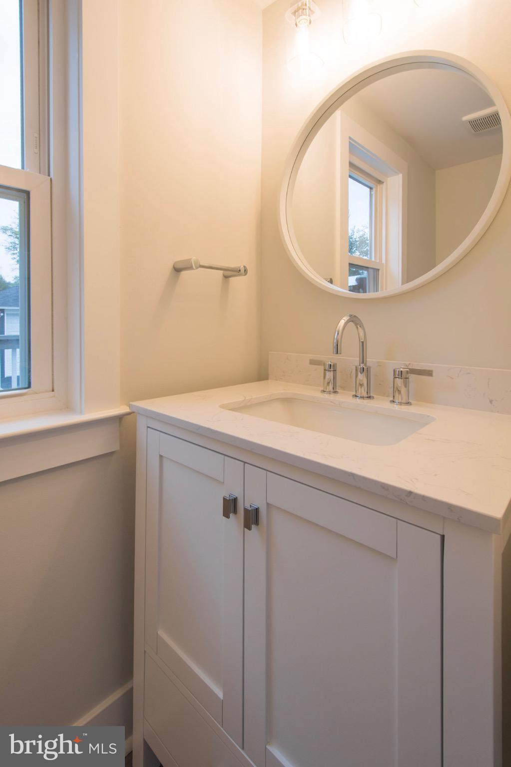 21 Manor Road Paoli, PA 19301 - Photo 9 of 35 a bathroom with a sink and a mirror