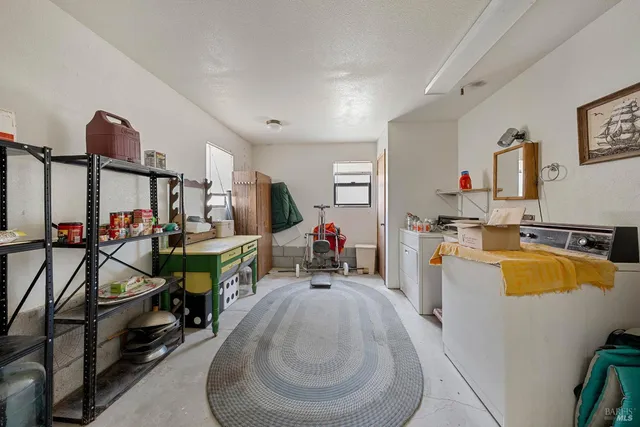 a bed room with a bed and gym equipment