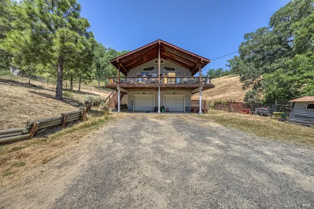 a view of house with outdoor space and seating space