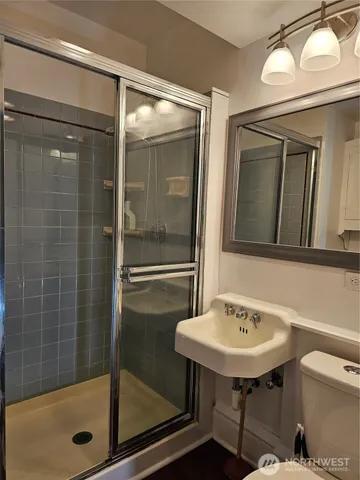 a bathroom with a sink a mirror and a bathtub