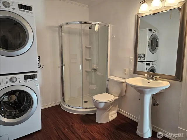 a bathroom with a sink toilet and a mirror