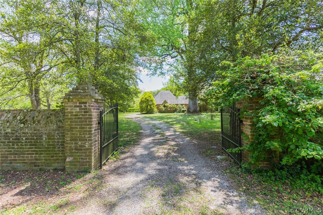 700 Rock Castle Road Goochland, VA 23063 - Photo 8 of 49 A brick wall and gated entrance marks the entry to